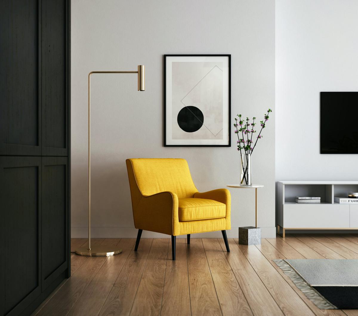Living room interior with yellow accent chair and framed artwork Living room interior with yellow accent chair and framed artwork