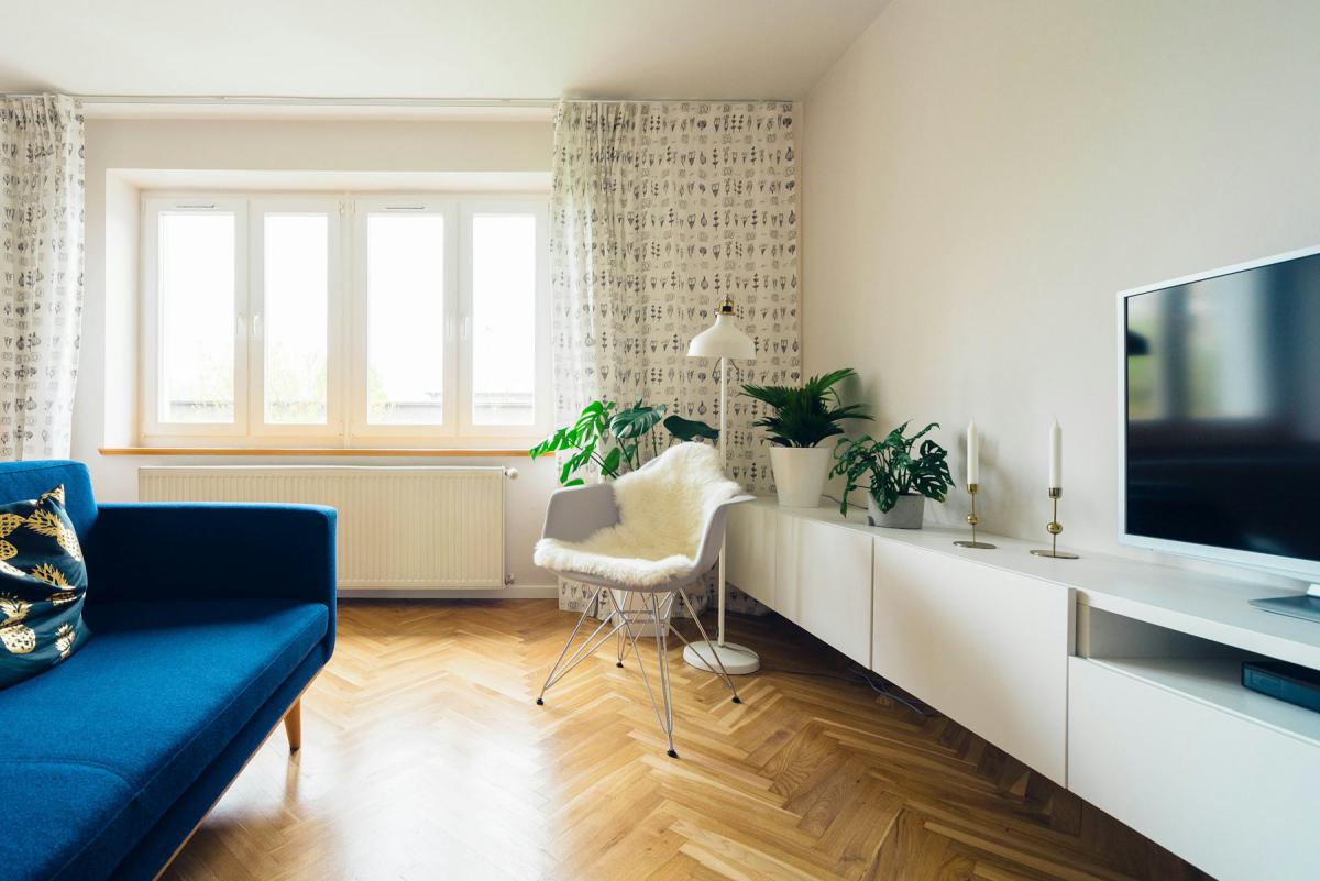 Apartment living room with minimal furniture and natural light — HR DES., JNTU