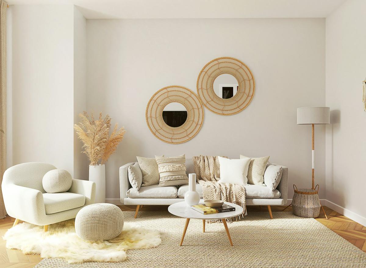 Contemporary living space with curved furniture and round mirrors