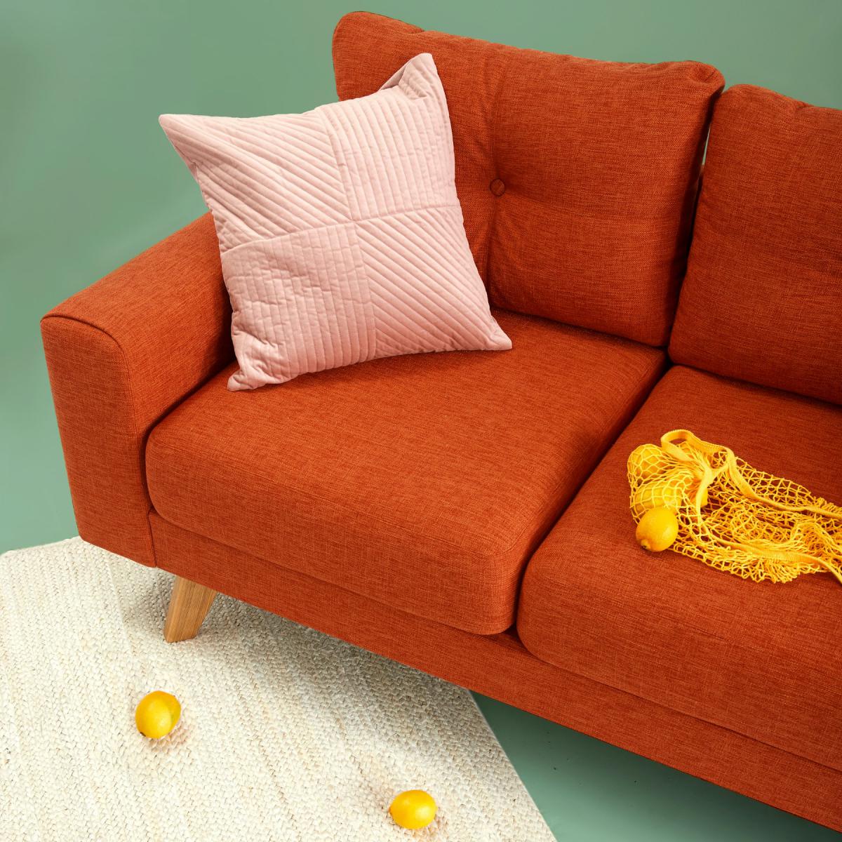 Custom furniture design detail of a tailored upholstered sofa Custom furniture design detail of a tailored upholstered sofa