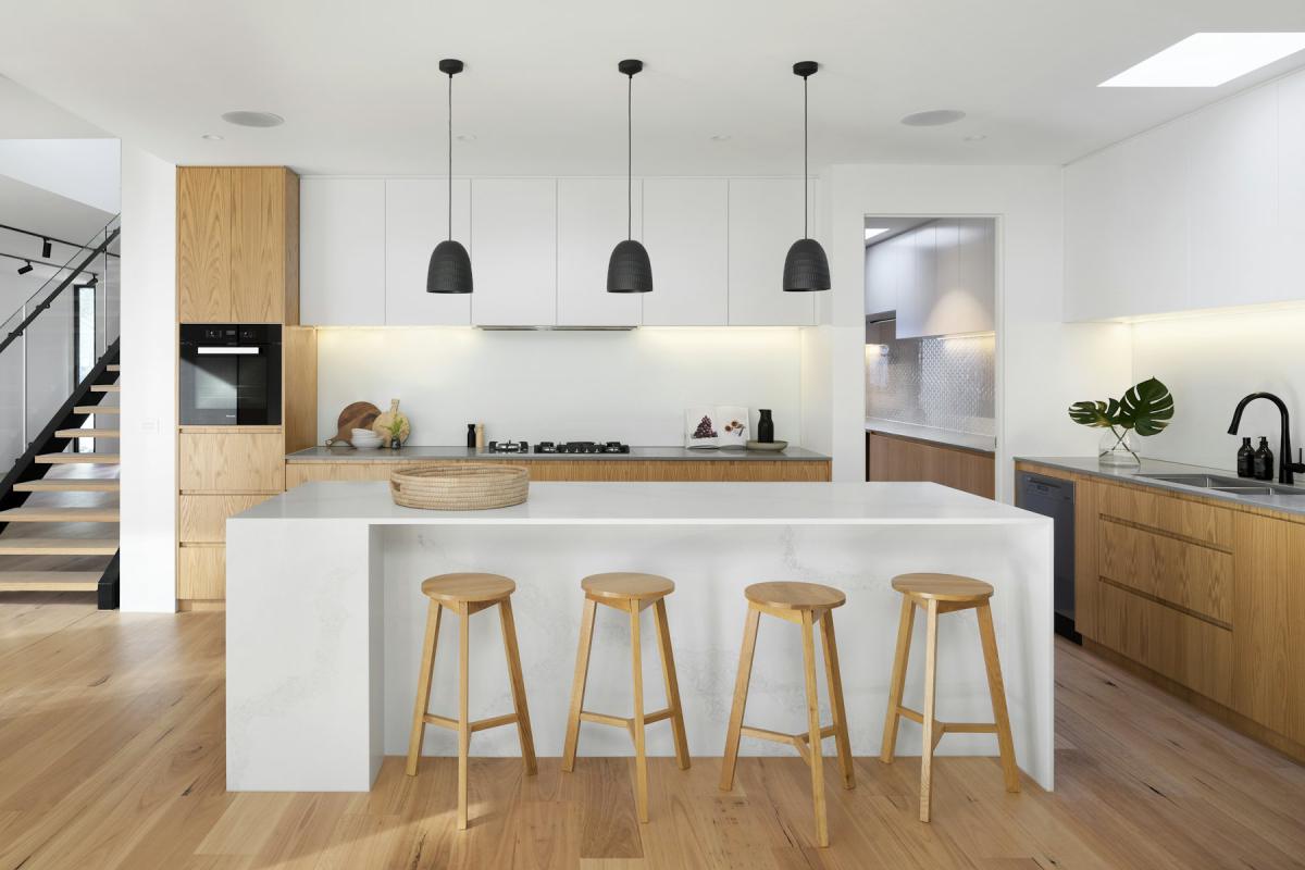 Modular Kitchen — Contemporary kitchen island with timber stools and white joinery