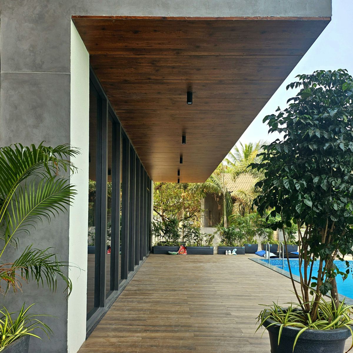 Finished turnkey villa with timber soffit veranda, planters and pool
